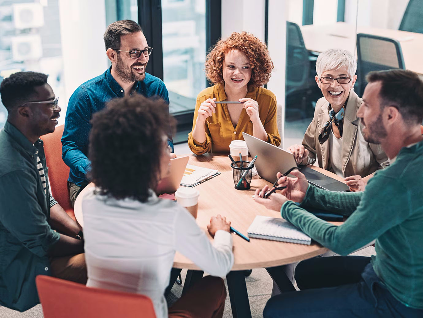 Group of employees having a discussion during a meeting