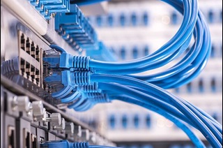Close up of LAN cables docked into ethernet ports