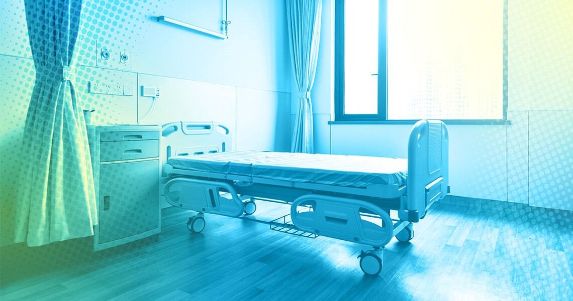 An empty hospital chamber, with a bed