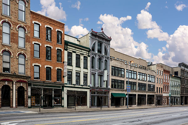 Empty street in front of old brick buildings